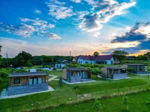 a group of modular homes in a yard at VINEA PANONIKA wine & mind retreat in Radenci