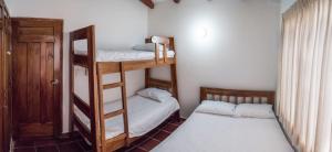 Postel nebo postele na pokoji v ubytování Cabaña Coveñas
