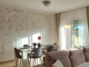 A seating area at Charming Apartment with a Cozy Terrace