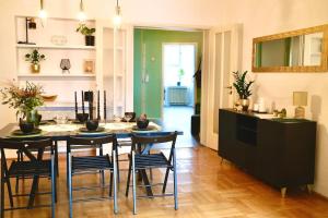 a kitchen and dining room with a table and chairs at Luxury Apartment in Old Town in Prague