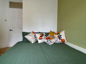 a bedroom with a bed with pillows on it at Bright and modern apartment in Grand Canal Docks in Dublin