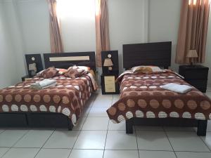 Postel nebo postele na pokoji v ubytování Hotel Residencial C´BASTIAN