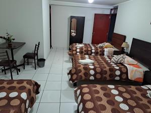 Postel nebo postele na pokoji v ubytování Hotel Residencial C´BASTIAN