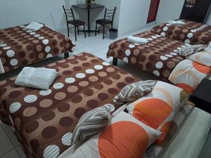 Postel nebo postele na pokoji v ubytování Hotel Residencial C´BASTIAN