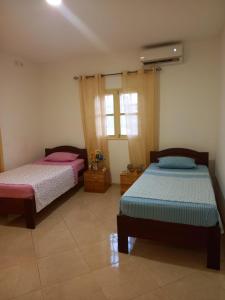En eller flere senger på et rom på VIP Guest House Campo de Milho