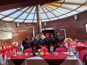 a group of men standing in front of a table at Hotel San Cristobal in San Cristóbal +37 photos