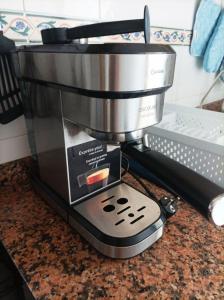a coffee maker sitting on top of a counter at Adosado a 300m de la playa in Bellreguart