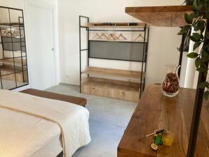 a living room with a table and a couch at Dimora Olio & Pepe in Trani