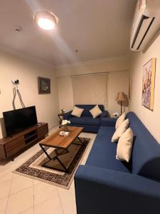 Ruang duduk di شقة مفروشة