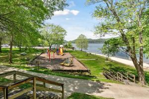 a park with a playground next to the water at CHLChateau-Walkable to Hurricane Marina in Silver Point
