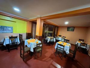 an overhead view of a restaurant with tables and chairs at HOSTAL HUAYNA HOUSE GO in Cusco