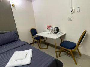 Postel nebo postele na pokoji v ubytování 2B Cozy Hostel ตรัง