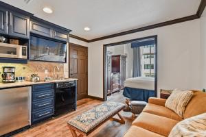 a kitchen and living room with a couch and a bed at Westgate 2BR, private balcony, multiple pools, resort amenities, tennis, onsite spa, restaurant 3912 in Park City