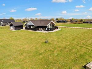 an aerial view of a house in a field at 6 person holiday home in Hadsund in Øster Hurup