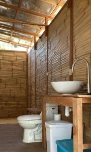 a bathroom with a toilet and a sink at Casa Lorinda in Lo de Marcos +59 photos