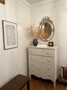 a dresser with a mirror on top of it in a room at We put the ‘Fun’ in your stay! in Walla Walla
