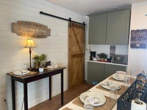 a kitchen with a table with plates on it at We put the ‘Fun’ in your stay! in Walla Walla