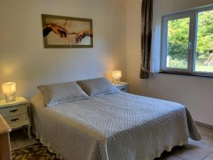 a bedroom with a bed and a window at Beautiful holiday location in Solís in Balneario Solís