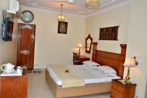 a bedroom with a large bed in a room at Bajaj Indian Home Stay in New Delhi