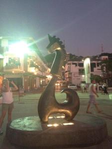 a statue of a dog on a street at night at Casa Romance Escondido in Puerto Vallarta