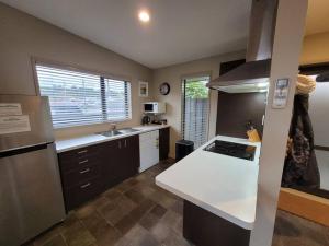 a kitchen with a white counter top in a kitchen at Junction Gem in Ohakune