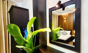 Giường trong phòng chung tại Rosa May Hotel