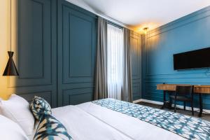 Postel nebo postele na pokoji v ubytování Hotel Twenties Tbilisi - Stay & Dine