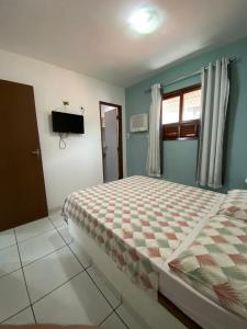 Ein Bett oder Betten in einem Zimmer der Unterkunft Apartamento Mobiliado Mozart