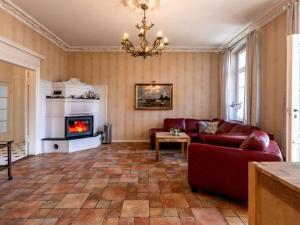 a living room with a couch and a fireplace at Salon Comfortable holiday residence in Heringsdorf