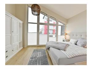 En eller flere senge i et værelse på Anchorage at Boddenmarkt