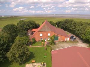 an overhead view of a large house with a yard at Windrose Comfortable holiday residence in Norddeich