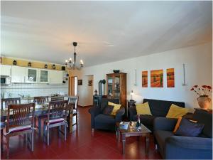 a living room with a couch and a table at Albatros Comfortable holiday residence in Juliusruh
