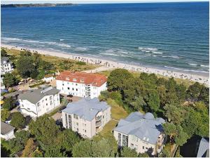 an aerial view of a beach with buildings and people at Evening sun Juliusruh in Juliusruh