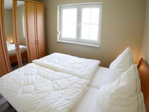 Ένα ή περισσότερα κρεβάτια σε δωμάτιο στο Zum Kuckuck Comfortable holiday residence