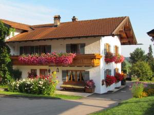 a house with flowers on the side of it at 1 - House Rosenegger in Staudach-Egerndach
