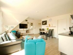 a living room with a couch and a table at Lüerßen directly by the sea apartment 2 in Steinhude