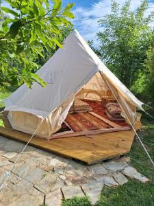 a tent that is sitting on a wooden platform at Camping Kromidovo in Kromidovo