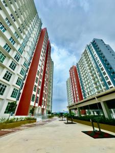 two tall buildings are next to each other at A Room - Stay With the Host in Ipoh