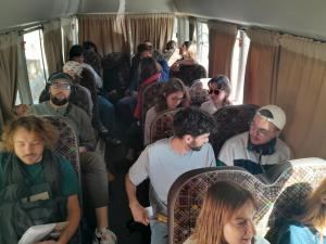 a group of people sitting on a train at فندق بيروت 2 New in Amman