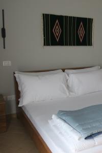 Postel nebo postele na pokoji v ubytování Doko Hotel