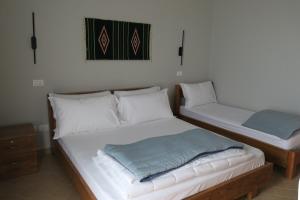Postel nebo postele na pokoji v ubytování Doko Hotel