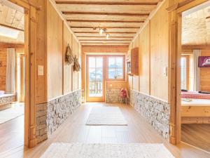 a room with wooden walls and a stone wall at Wellness Chalet Bergschlössl in Hippach