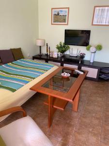 a living room with a couch and a coffee table at Siana 1 Apartment in Sveti Vlas