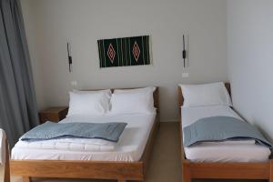 Postel nebo postele na pokoji v ubytování Doko Hotel