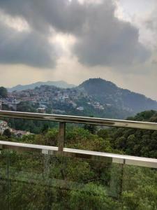 a view of a city from a bridge at Hotel Aaria in Mussoorie