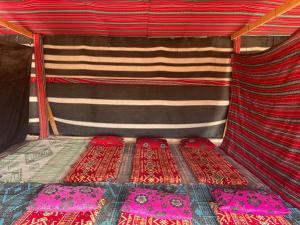 a view of the inside of a bed in a tent at חאן נחל חווה Han Nahal Hava in Mitzpe Ramon