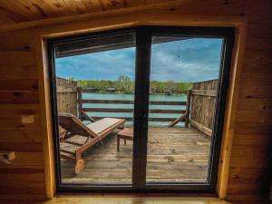 a view from the inside of a cabin with a large window at Mini Tri in Ulcinj