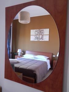 A bed or beds in a room at Camurria Sicilian B&B