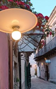 a street with a light on a building at Residenza Donnafugata B&B in Ragusa