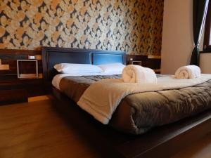 A bed or beds in a room at Camurria Sicilian B&B